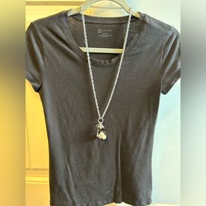 Long black and white charm necklace